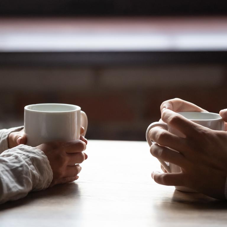 Stock Couple Talking Over Coffee