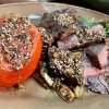 Beef Steaks with Za'atar Dressing, Roasted Tomatoes and Eggplant, Greens with Olive Oil and Lemon