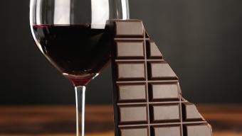 glass of red wine and dark chocolate bar