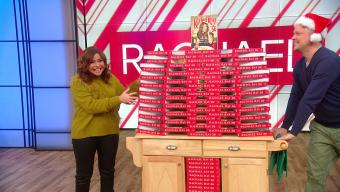 Rachael Ray with copies of her cookbook