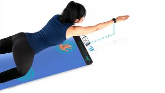 woman using YogiFi yoga mat