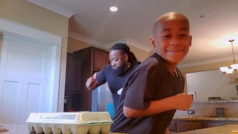 Marcus and MJ dancing in the kitchen