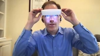 Dr. Breus wearing light therapy glasses
