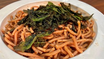 pasta with red onion sauce and crispy kale