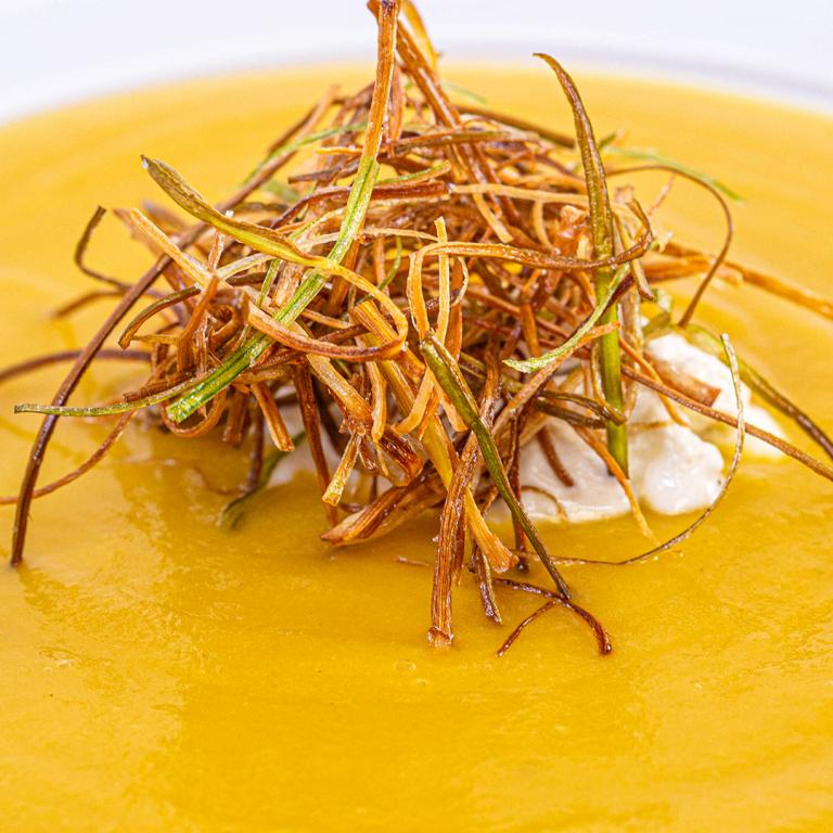 Pumpkin Soup With Allspice Whipped Cream & Fried Leeks