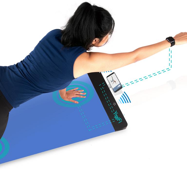 woman using YogiFi yoga mat