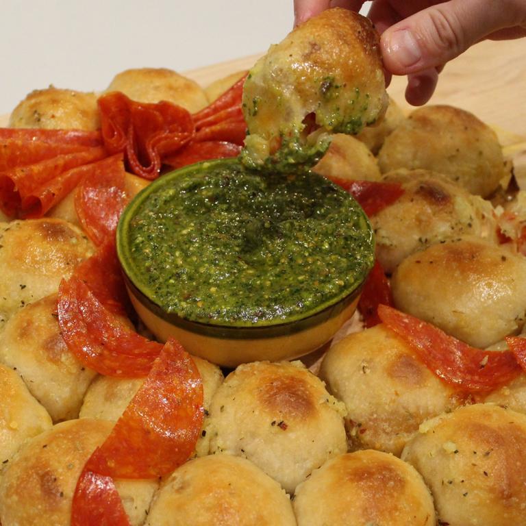 Pepperoni Pizza-Stuffed Pull-Apart Wreath With Pesto Dipping Sauce