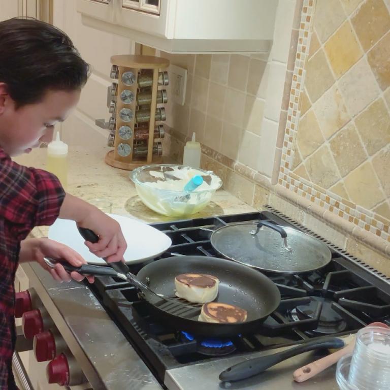Matthew making souffle pancakes