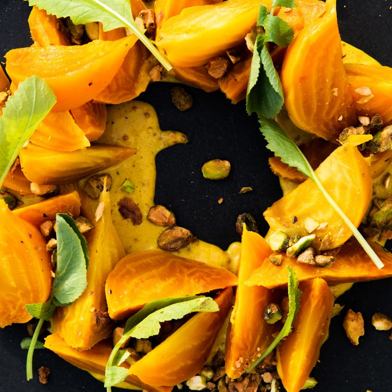 Poached Golden Beets with Curry Dressing and Pistachios     