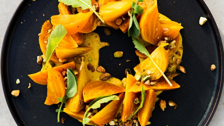 Poached Golden Beets with Curry Dressing and Pistachios     