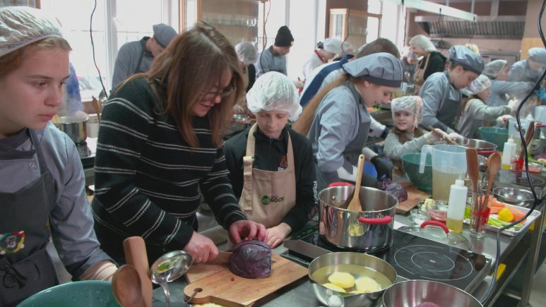 Rachael Ray teaching kids how to cook in Ukraine.